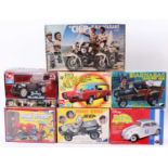 A collection of boxed vehicle and TV related plastic kits to include AMT/ERTL, Revell, MPC and