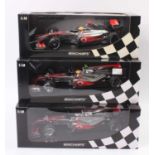 A Minichamps 1/18 scale Vodafone Maclaren Mercedes F1 racing car group to include a 2010 Jenson