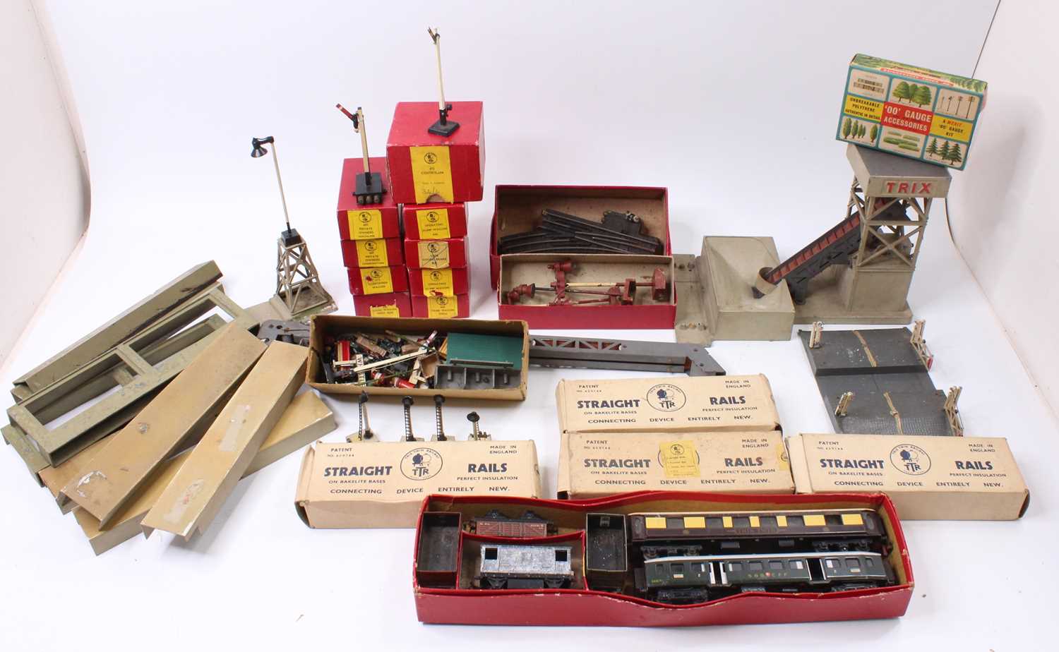 A collection of mainly Trix 00 gauge. Three locomotives, rolling stock. Whistle kit, Elevator