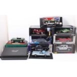 A collection of nine various boxed and part boxes 1/18 scale diecast vehicles to include Corgi,