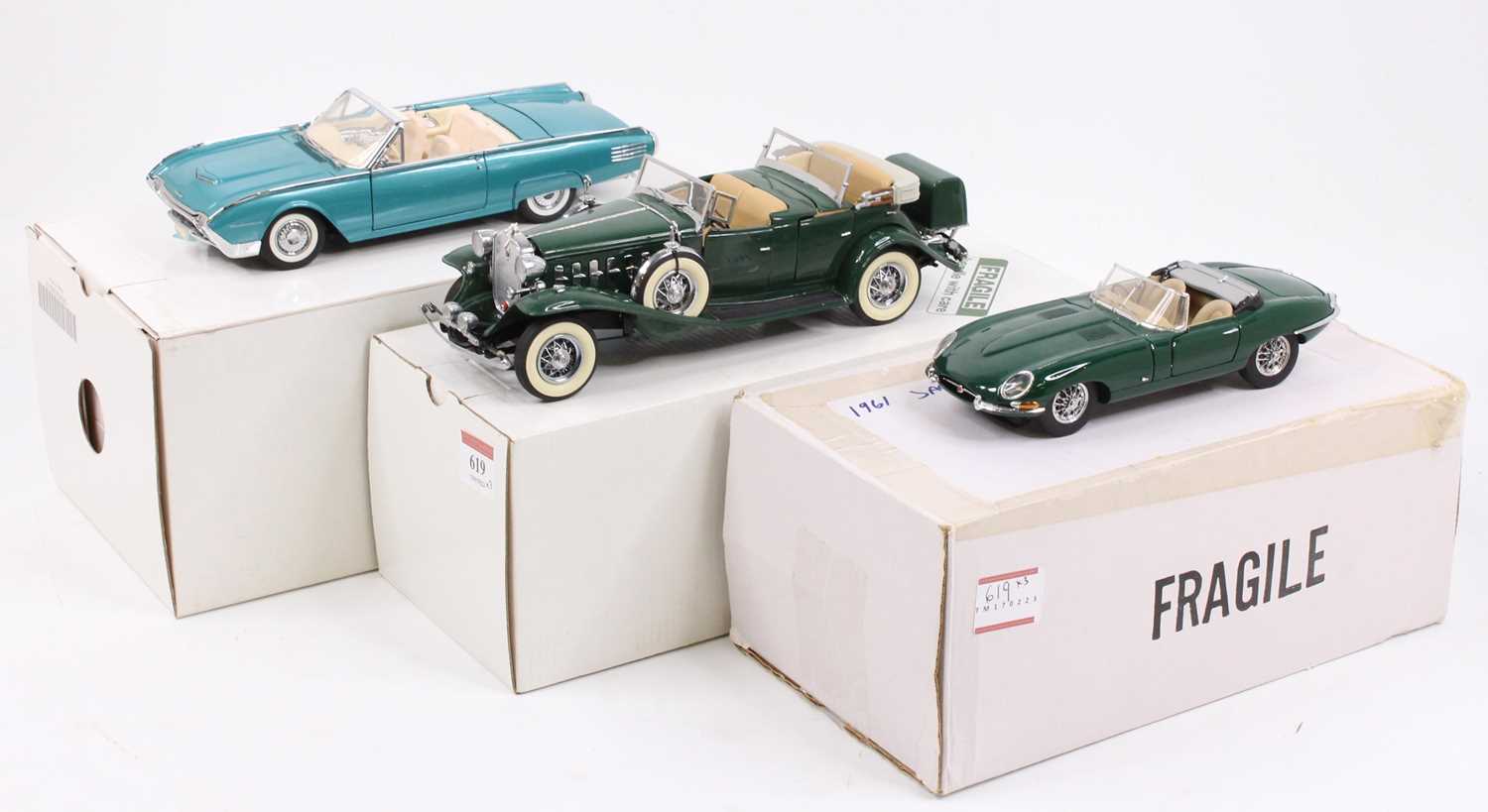 A collection of three Danbury Mint 1/24 scale boxed diecast vehicles to include a 1961 Ford