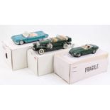 A collection of three Danbury Mint 1/24 scale boxed diecast vehicles to include a 1961 Ford