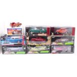 A collection of 9 various boxed 1/18 and 1/24 scale, mainly American interest, diecast vehicles to