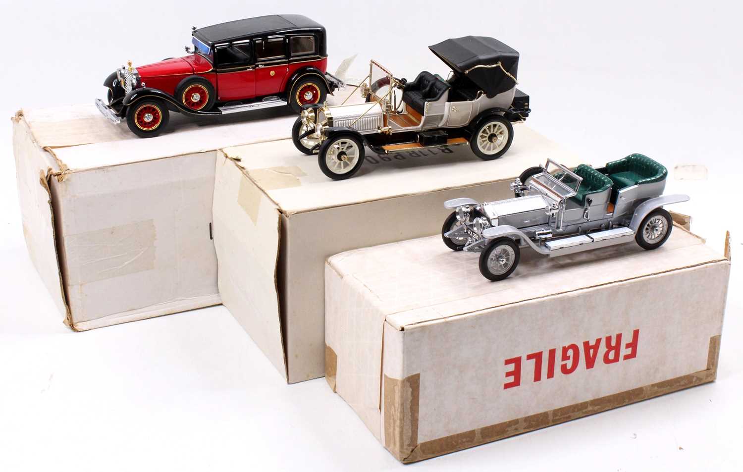 A collection of three various boxed Franklin Mint 1/24 scale diecast vehicles, including a 1912