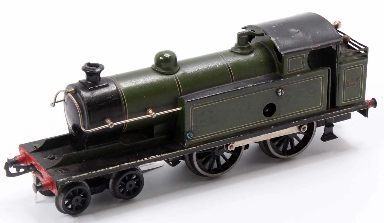 Believed to be a modified Bing clockwork 4-4-0 tank loco running no.3410 olive green lined black &