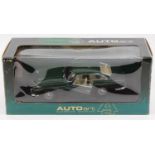 An Auto Art Classic Division 1/18 scale model of an Aston Martin DB5, finished in green, model No.