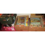 Four boxes of jigsaws and board games, to include Good Companion series, Ambassador and others