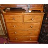 A mid-Victorian mahogany round cornered chest of two short over three long drawers with turned