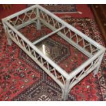 A contemporary bamboo effect glass topped rectangular coffee table, length 102cm