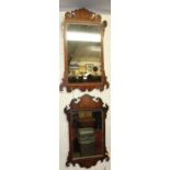 An early 20th century Chippendale style mahogany fret cut rectangular wall mirror (with losses and