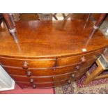 An early 19th century mahogany bowfront chest of two short over three long drawers, w.107cm