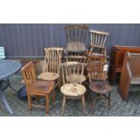 A collection of various stickback and other pub chairs