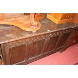 An 18th century provincial joined oak four panelled hinge topped coffer, w.148cm