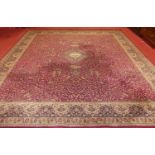 A Persian style European manufactured machine woven red ground Tabriz carpet, 410 x 360cm