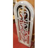 A pair of decorative painted wooden framed wall mirrors, with wrought iron grilles, 123 x 41cm