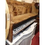 A Victorian stained pine three-seater church pew, w.144cm