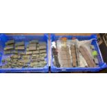 Two trays of H0 and 00 scale rolling stock and kit-built military vehicles