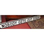 A contemporary painted wall sign titled 'Nobody gets out sober', length 133cm