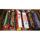 A box of Corgi 1:50 scale road haulage tractor units and trailers