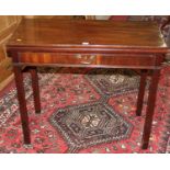 An early 19th century mahogany fold-over tea table, having rear gateleg and single frieze drawer,