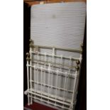 A Victorian white painted wrought iron and brass single bedstead, with side rails and base section