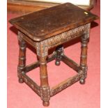 A joined and relief carved oak joint stool, on turned and square cut supports untied by lower