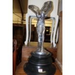 A large contemporary cast chromed metal figure of The Spirit of Ecstasy, raised on turned and