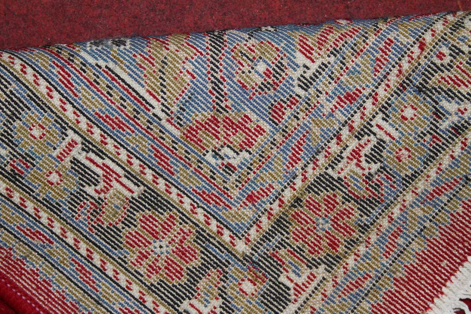 A Persian style red ground woollen Tabriz long hall runner, 395 x 98cm - Image 3 of 3