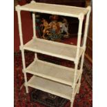 A contemporary cream painted simulated bamboo and cane inset four-tier open stand, w.69.5cm