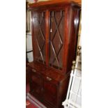 A late Victorian mahogany bookcase cupboard, having twin astragal glazed upper doors, w.91cmNot