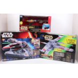 A collection of boxed modern release Star Wars related vehicles and play sets to include a Kenner