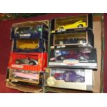 Two boxes containing a collection of 1/18 scale diecast vehicles to include American Muscle,