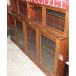 A mid-20th century mahogany two-tier eight door bookcase, with interior shelves, w.214cm