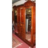 A circa 1900 mahogany, floral satinwood inlaid and further crossbanded two-piece bedroom suite,