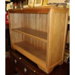 A contemporary light oak low freestanding open bookshelf, w.115cm