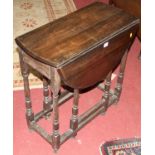 An antique oak dropflap gateleg occasional table, having single end drawer, w.67cm