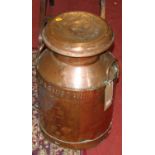 An early 20th century copper twin handled milk churn and cover, titled Torrington, h.53cm
