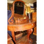 A mid-Victorian mahogany demi-lune swing mirrorback dressing table, w.100cm