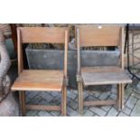 A pair of 1930s oak folding picnic chairs