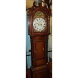 An early 19th century provincial oak and mahogany crossbanded longcase clock, having an arched