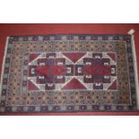 A small Persian blue ground Shiraz hall rug, 142 x 82cm