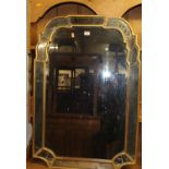 An early 20th century gilt framed and marginal inset shaped rectangular wall mirror (losses and