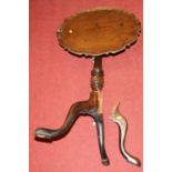 A circa 1900 mahogany piecrust topped tilt-top pedestal tripod occasional table (one leg snapped and