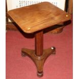 A circa 1830s mahogany round cornered tilt-top pedestal tripod table, raised on octagonal faceted