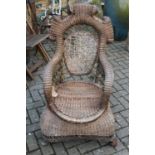 A mid-20th century wicker conservatory armchair