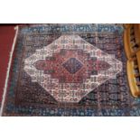 A Persian woollen blue ground Shiraz rug, 157 x 125cm