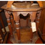 An early 20th century line carved oak octagonal two-tier occasional table, w.58cm