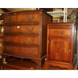 A reproduction mahogany serpentine front chest of four long drawers, w.71cm; together with a pair of