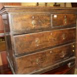 An antique oak low squarefront chest of two short over two long drawers, w.82cm; together with a