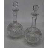 A pair of Edwardian cut glass decanters and stoppers, each having slender neck and bulbous body with